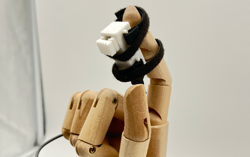 Fingertip indentation feedback device